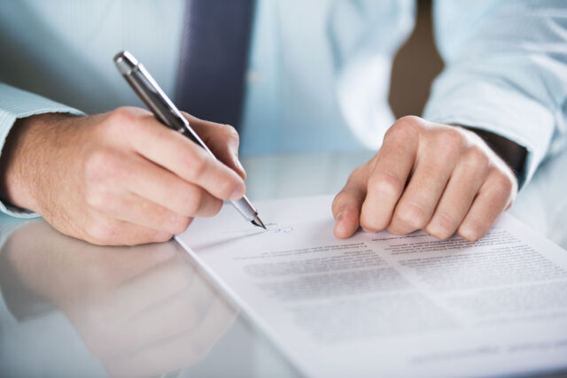 man writing letter