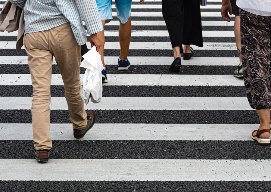 pedestrians walking crosswalk