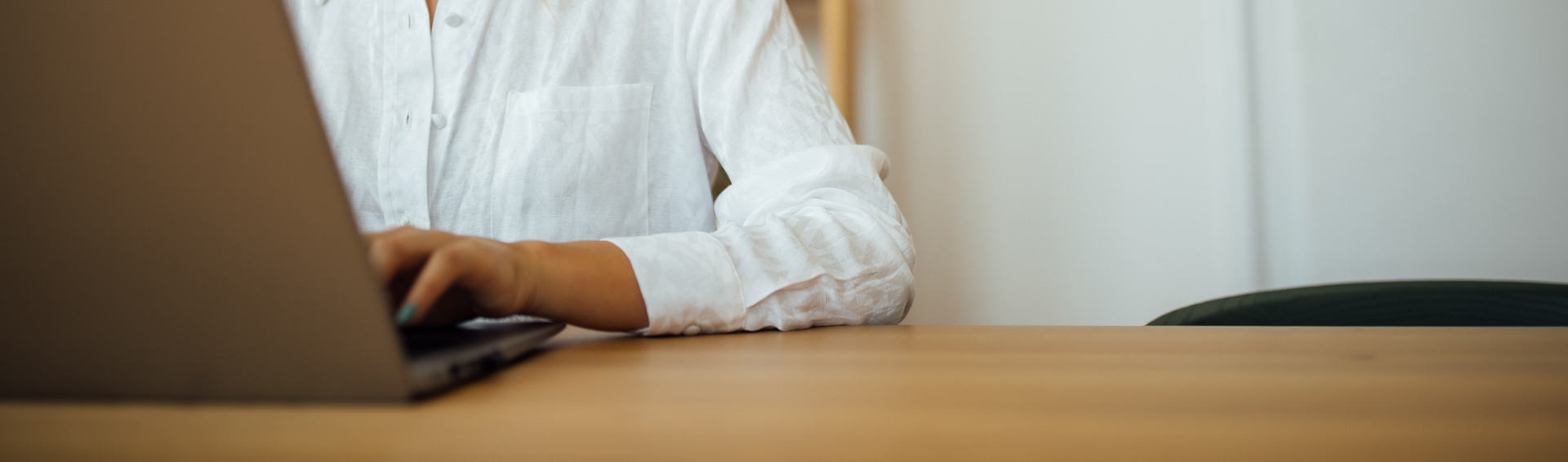 Young beautiful woman working on laptop at home office copy space portrait