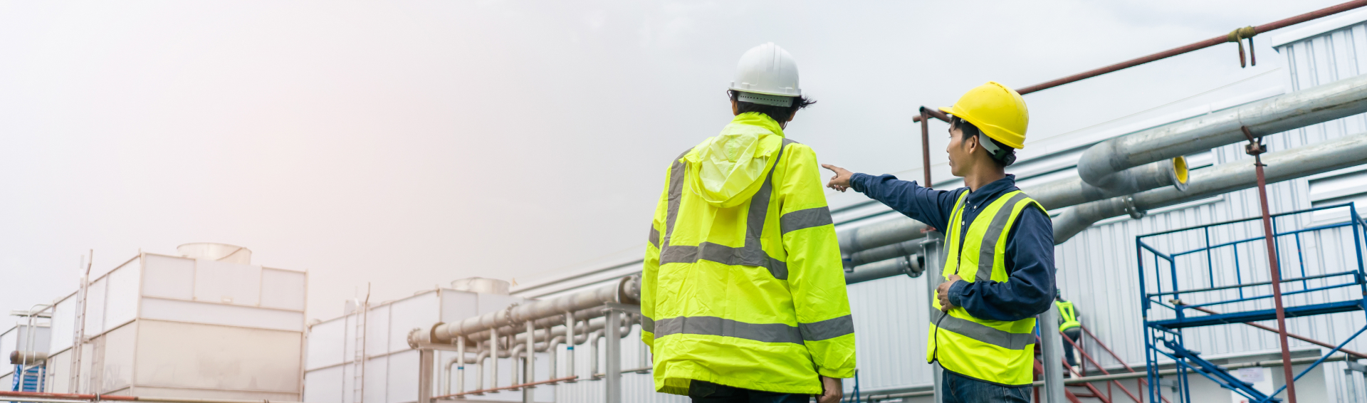 Construction workers standing outside work site reviewing work -Panama City FL Construction Accident Attorneys concept image