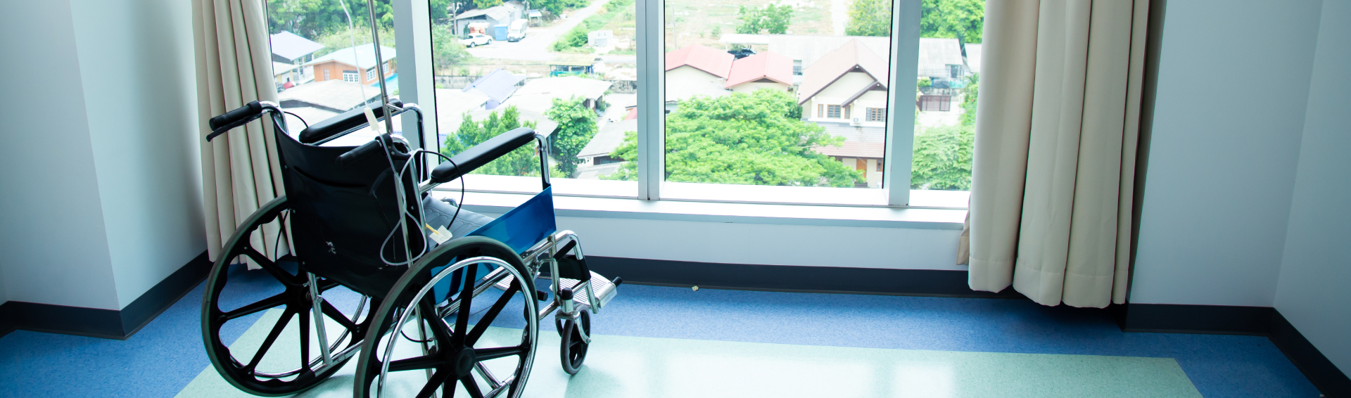 An empty wheelchair in an empty lonely nursing home - Nursing Home Abuse Attorneys in Panama City concept image