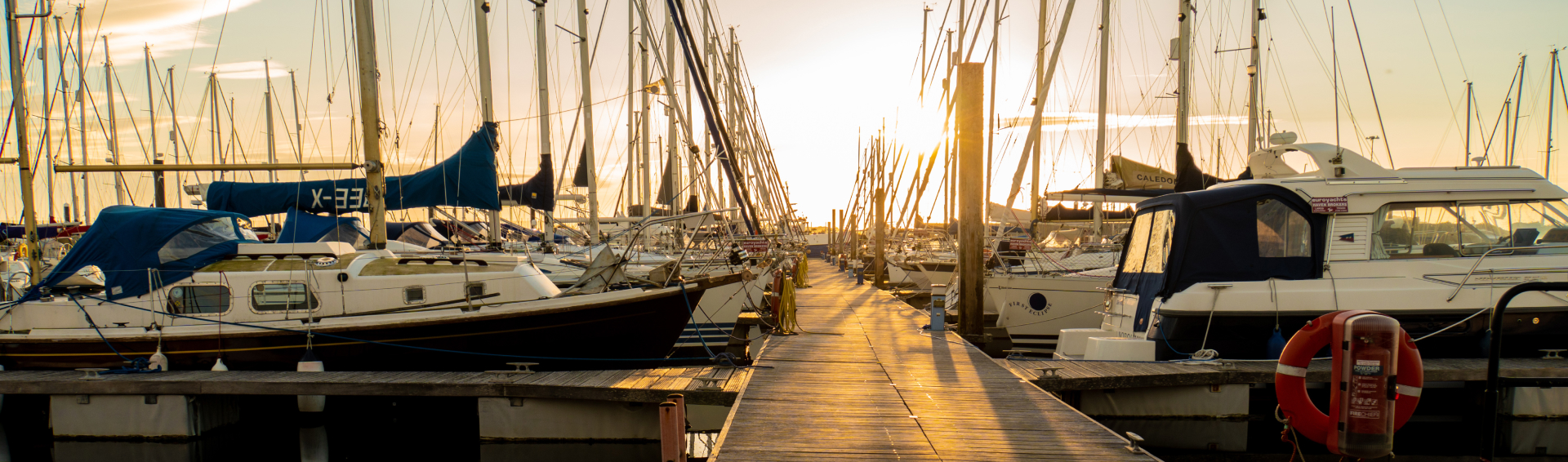 Various boats docked at sunset in Panama City FL - Boat Accident Attorneys concept image